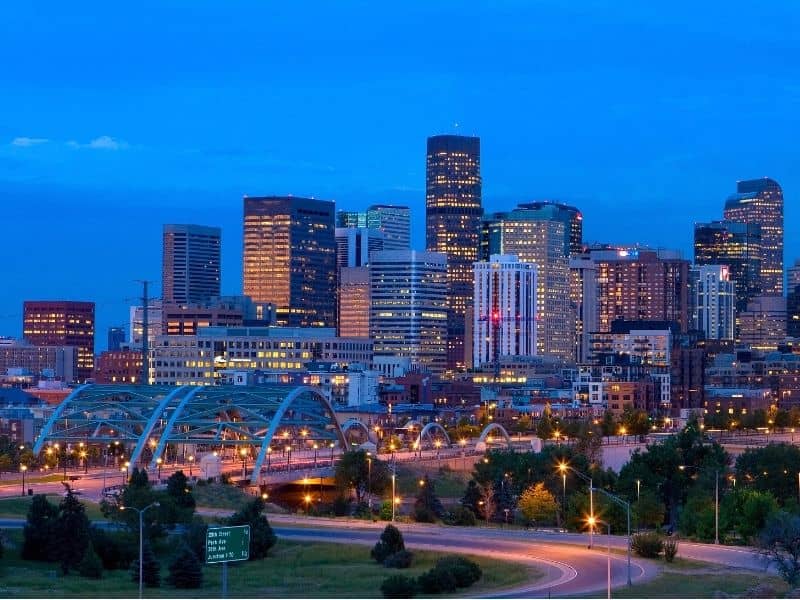 City skyline with illuminated buildings, bridges, and urban landscape for Panama City land surveying services